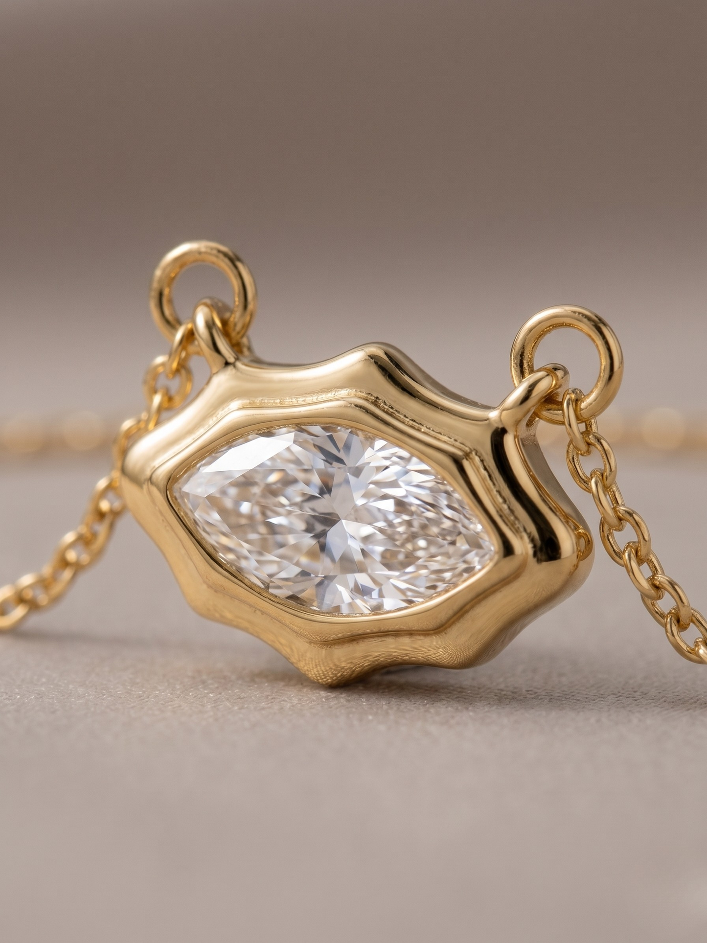Gold necklace with a marquise pendant 