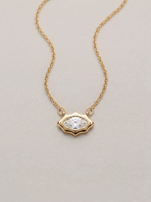 Gold pendant necklace with a marquis cut stone